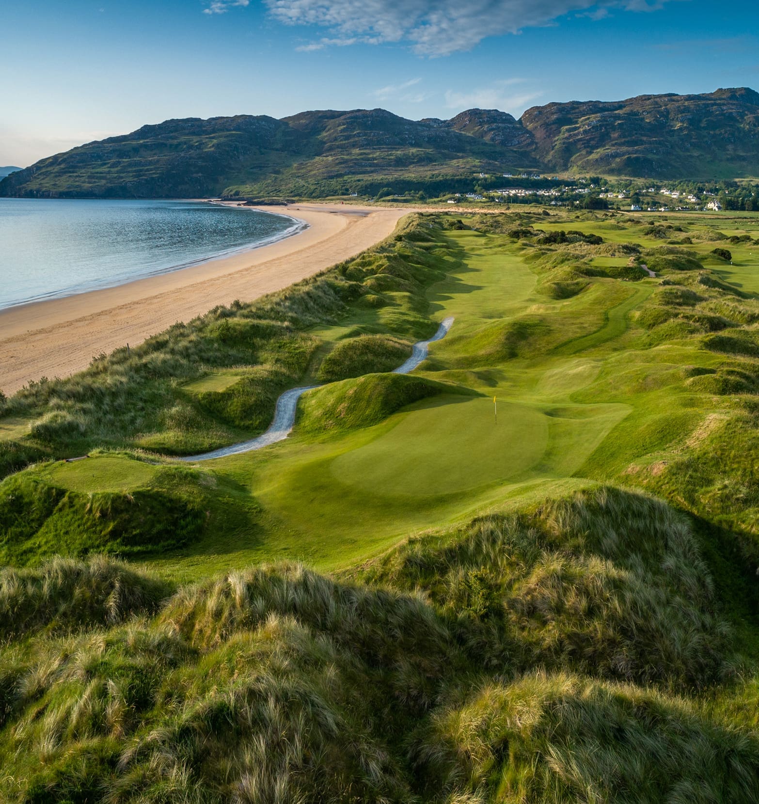 Aerial view of Portsalon Golf Club with Ballymastocker Bay in the background.