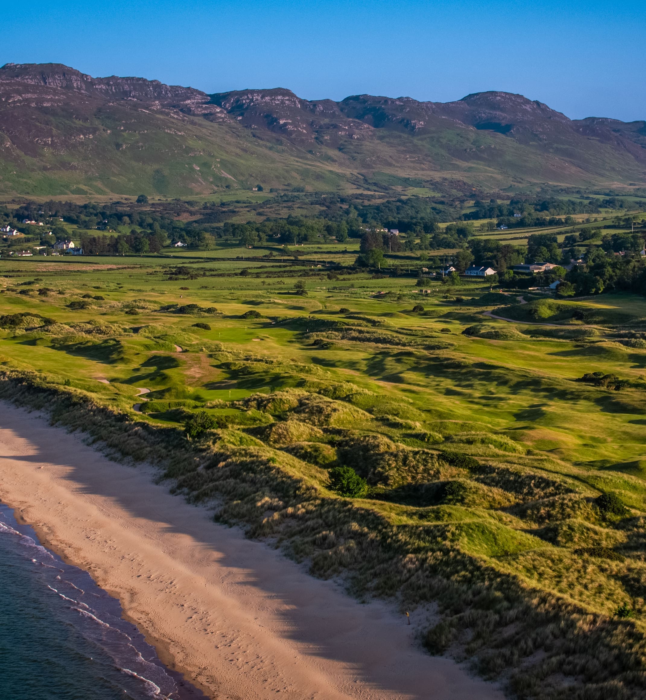 Aerial view of Portsalon Golf Club with Ballymastocker Bay in the background